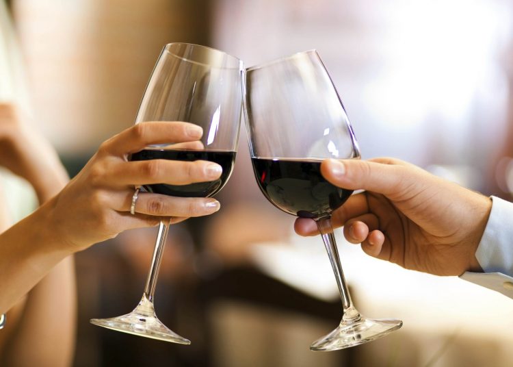 Couple toasting wine glasses